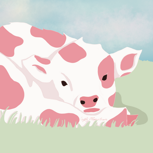 Strawberry cow resting in a field